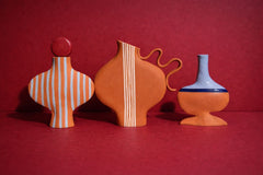 Blue Striped Terracotta Vessel With A Burgundy Stopper