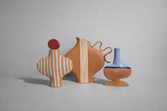 Blue Striped Terracotta Vessel With A Burgundy Stopper