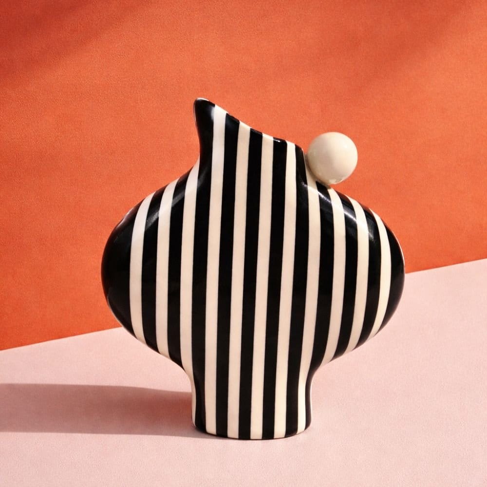 Black Striped Vessel With A Ball Handle